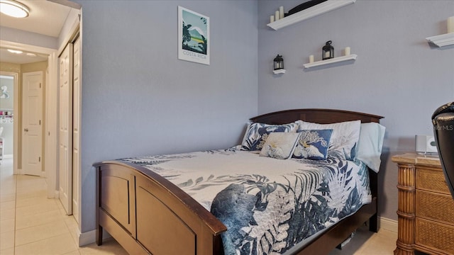 bedroom featuring light tile patterned floors