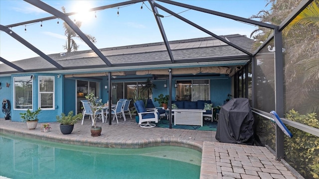 back of house featuring a patio area, ceiling fan, and outdoor lounge area