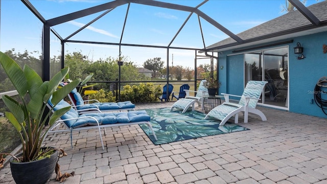 view of patio / terrace with a lanai