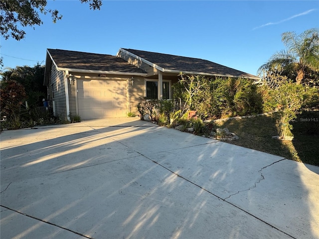 single story home featuring a garage