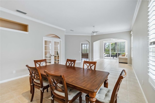 dining space featuring ornamental molding, french doors, ceiling fan, and light tile patterned flooring