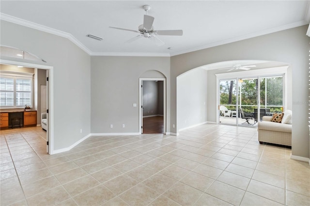 spare room featuring light tile patterned flooring, ceiling fan, and ornamental molding