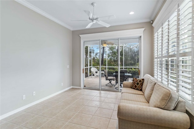 living room with ornamental molding, ceiling fan, and light tile patterned flooring