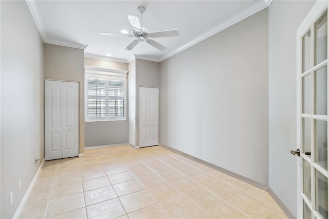 unfurnished bedroom with ornamental molding, light tile patterned floors, ceiling fan, and french doors