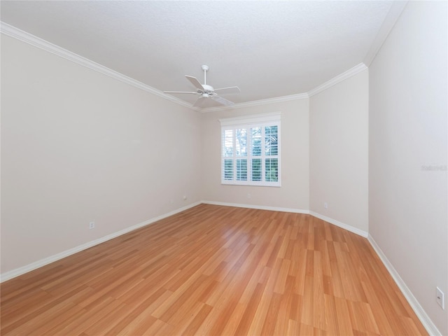 unfurnished room featuring crown molding, ceiling fan, and light hardwood / wood-style flooring