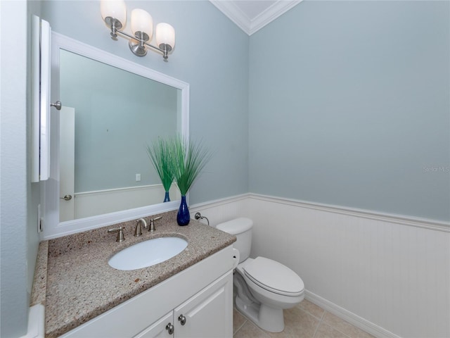 bathroom featuring ornamental molding, vanity, tile patterned floors, and toilet