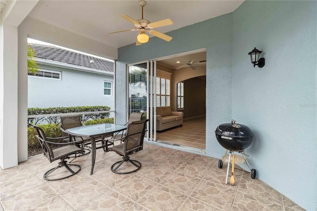 sunroom / solarium with ceiling fan