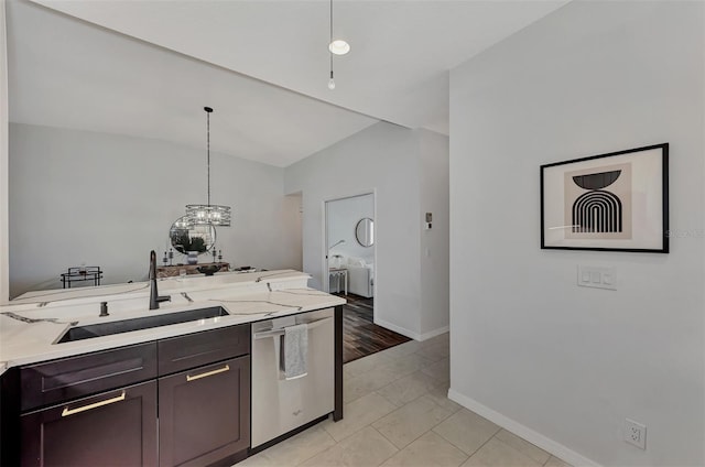 kitchen with sink, stainless steel dishwasher, dark brown cabinets, light stone countertops, and pendant lighting