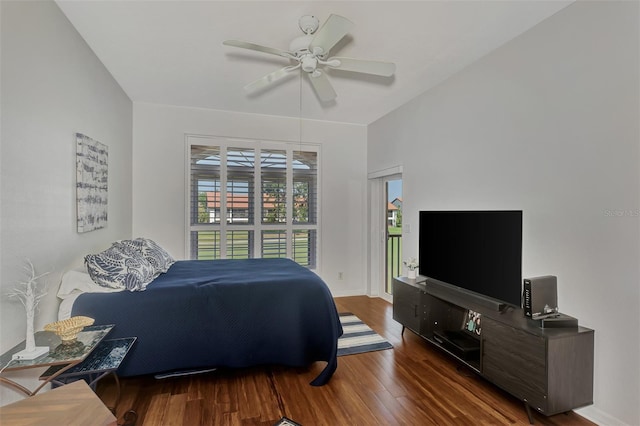 bedroom with ceiling fan and dark hardwood / wood-style flooring