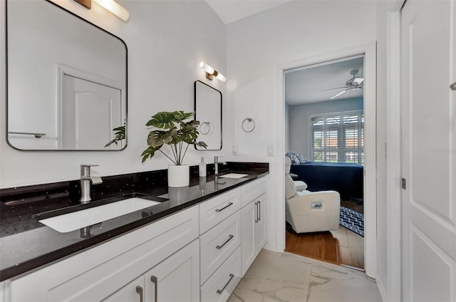 bathroom with ceiling fan and vanity