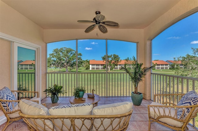 sunroom / solarium with ceiling fan