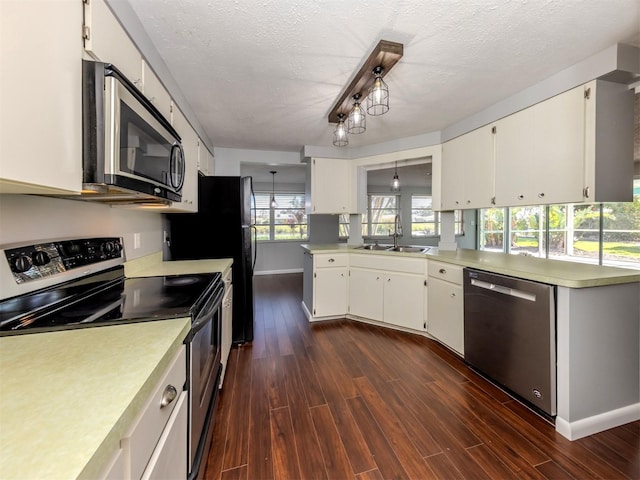 kitchen with sink, white cabinets, appliances with stainless steel finishes, and a textured ceiling