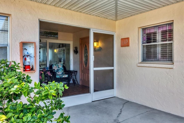 entrance to property with a patio area