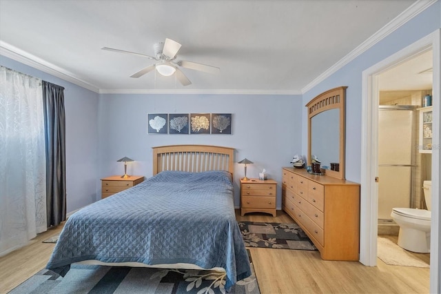 bedroom with ensuite bath, ceiling fan, light hardwood / wood-style flooring, and ornamental molding