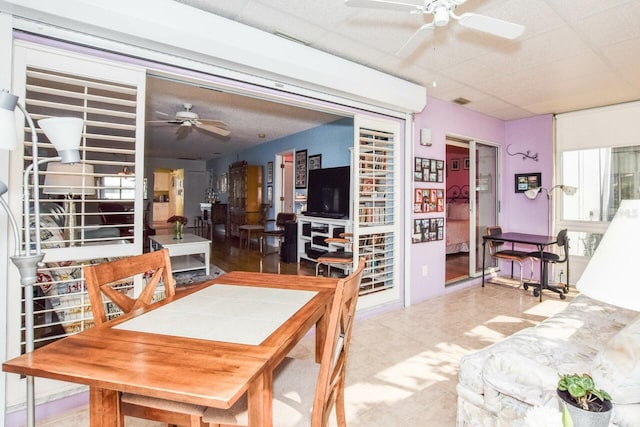 dining room with a paneled ceiling