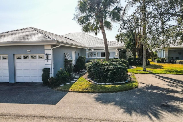 single story home with a garage