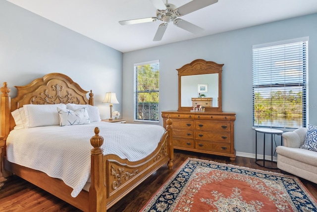 bedroom with ceiling fan and dark hardwood / wood-style flooring