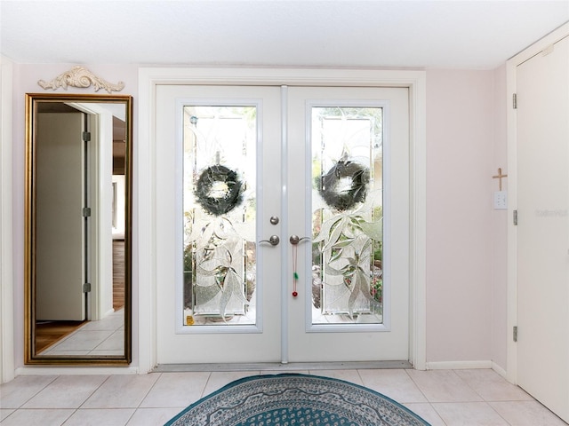 doorway to outside featuring french doors and light tile patterned flooring