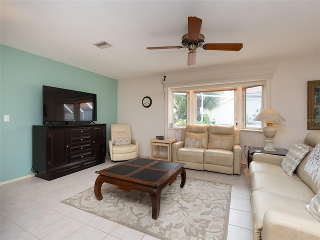 living room featuring ceiling fan and light tile patterned floors