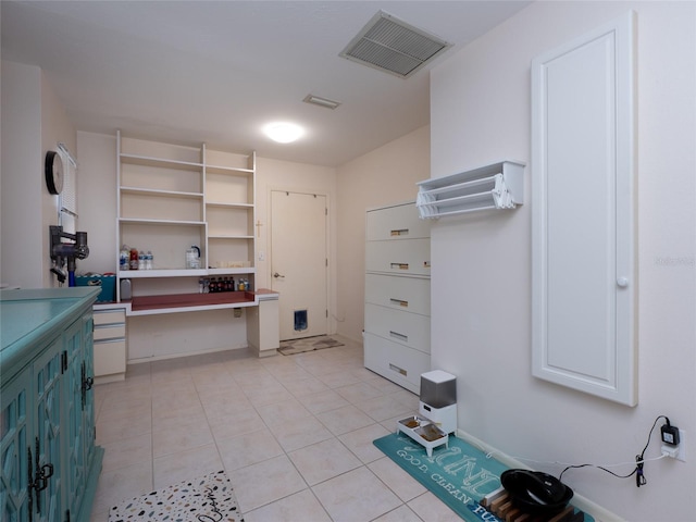 spacious closet with light tile patterned flooring