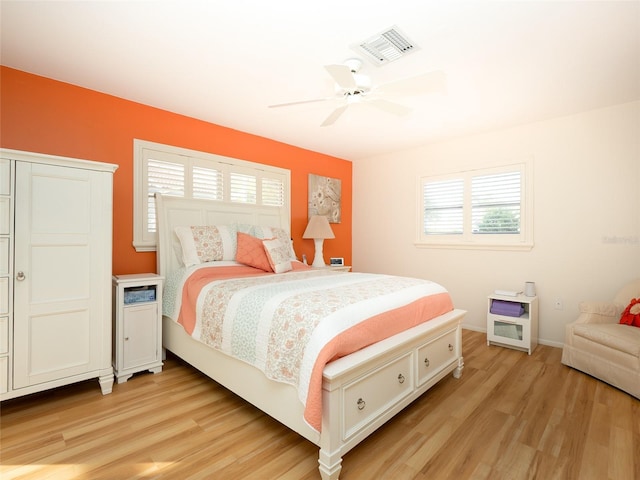 bedroom featuring ceiling fan and light hardwood / wood-style floors