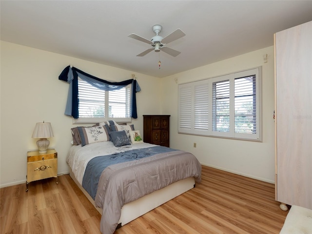 bedroom featuring light wood-type flooring and ceiling fan