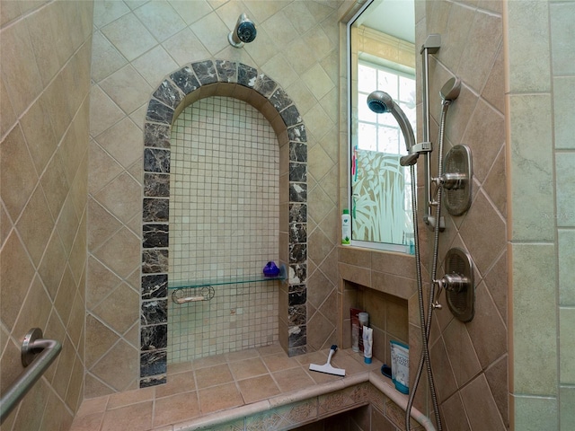 bathroom with a tile shower