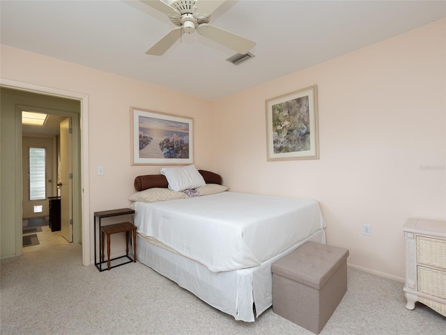 bedroom with ceiling fan and light colored carpet