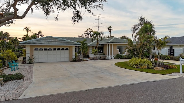 ranch-style home featuring a garage