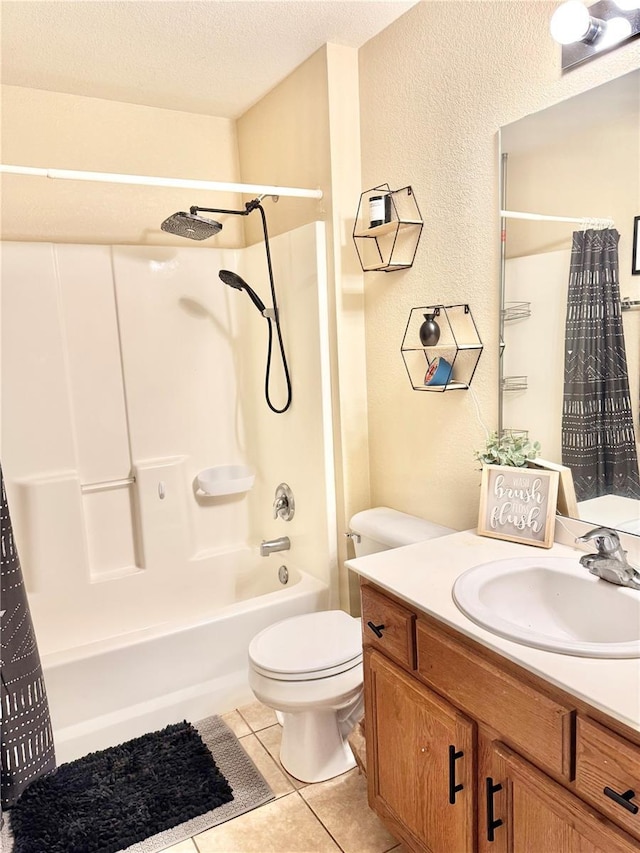 full bathroom featuring toilet, shower / bath combo with shower curtain, tile patterned floors, a textured ceiling, and vanity