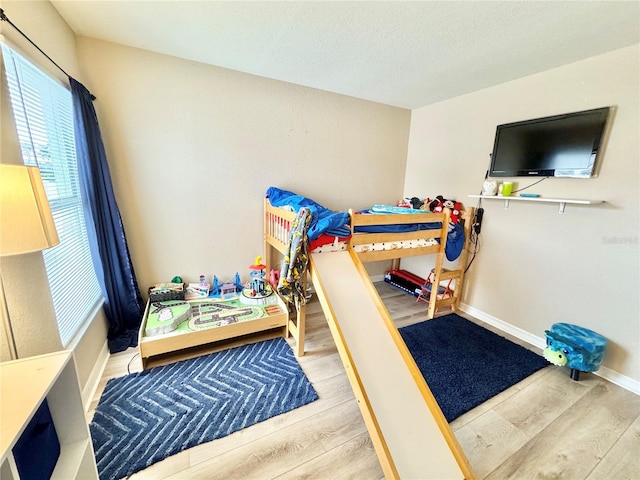 bedroom with hardwood / wood-style flooring