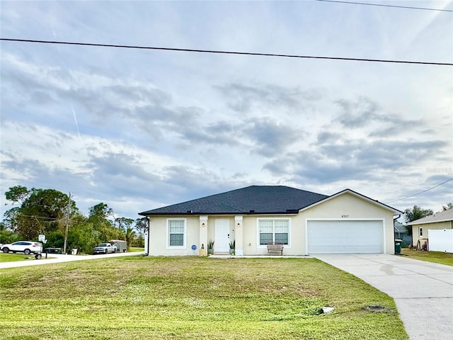 view of front facade with a garage and a front lawn