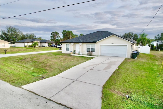 ranch-style house featuring a garage and a front yard