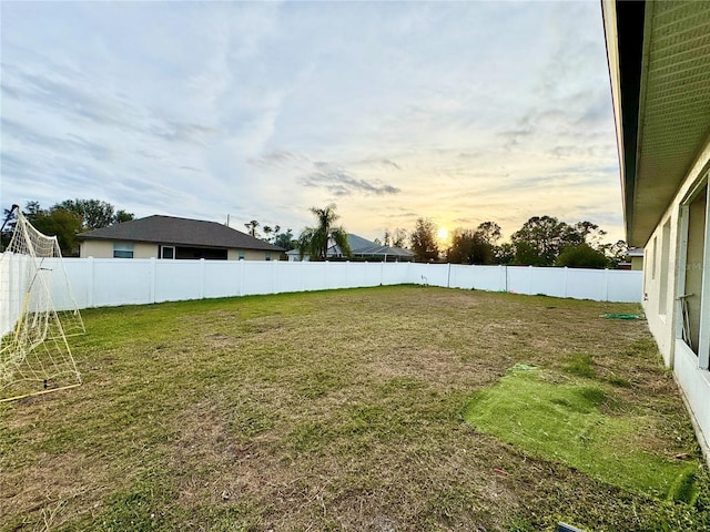 view of yard at dusk