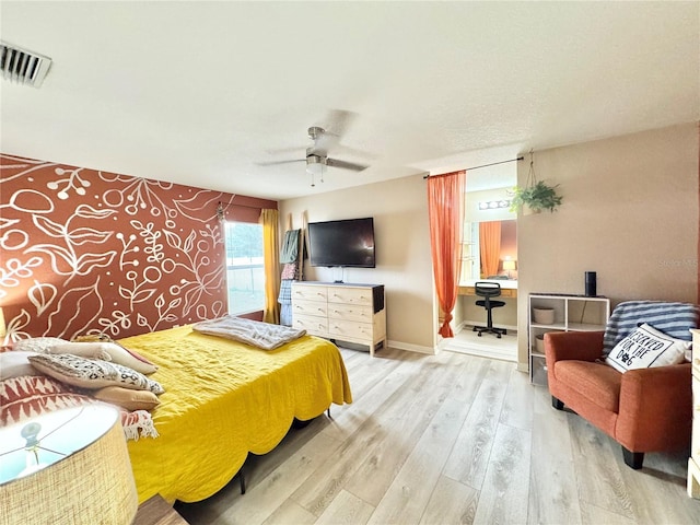 bedroom with hardwood / wood-style flooring and ceiling fan