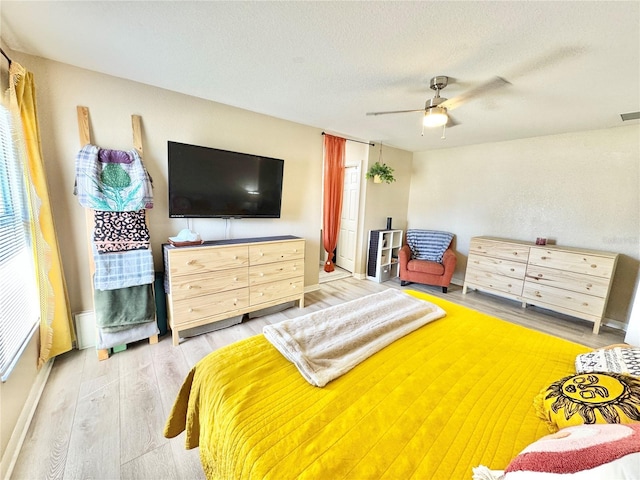 8307 Glover Ave, North Port, FL 34291 - bedroom featuring ceiling fan, a textured ceiling, and wood finished floors