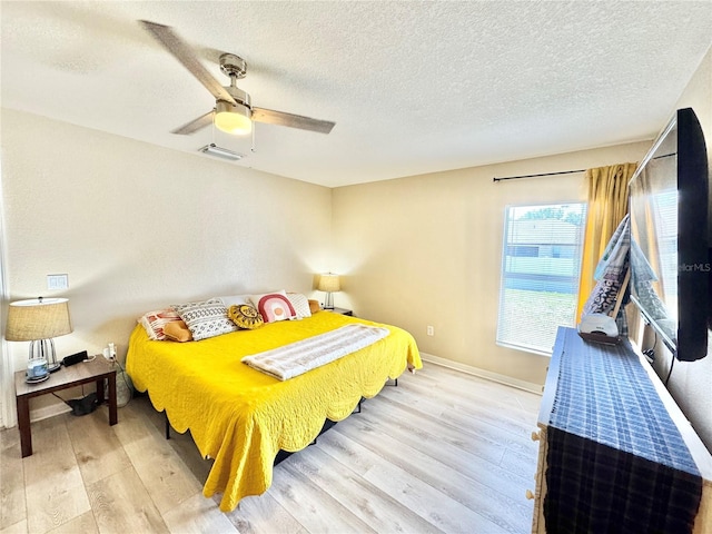 8307 Glover Ave, North Port, FL 34291 - bedroom with wood finished floors, baseboards, a ceiling fan, and visible vents