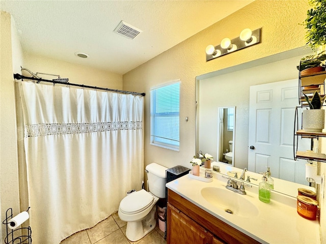 8307 Glover Ave, North Port, FL 34291 - full bath with vanity, visible vents, toilet, a shower with shower curtain, and tile patterned floors
