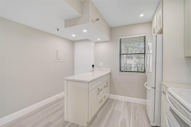 bathroom featuring vanity and hardwood / wood-style floors