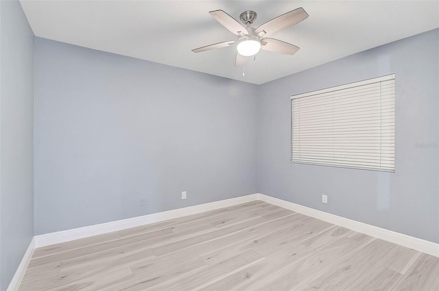 spare room featuring ceiling fan and light wood-type flooring