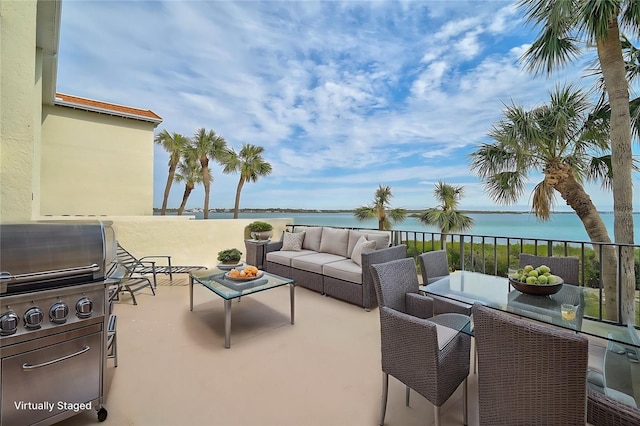 view of patio / terrace with an outdoor hangout area and a water view