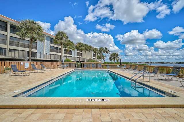 view of swimming pool with a patio area