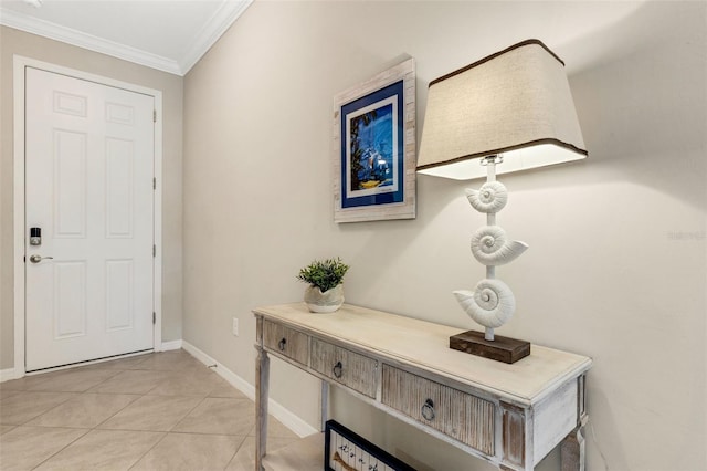 tiled foyer entrance with ornamental molding