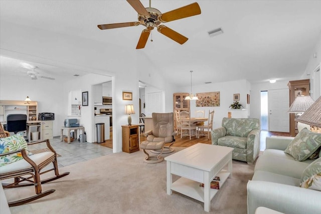 living room featuring light colored carpet and ceiling fan