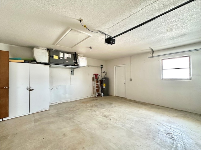 garage featuring a garage door opener and electric water heater