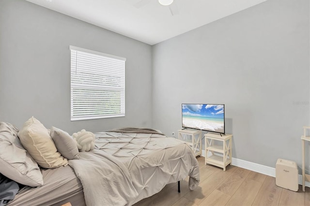 bedroom featuring ceiling fan and light hardwood / wood-style floors