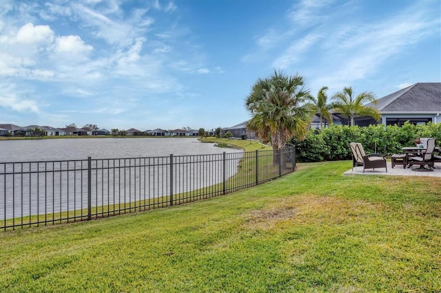 view of yard featuring a patio area and a water view