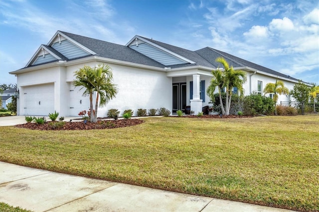 view of front of home with a garage and a front yard