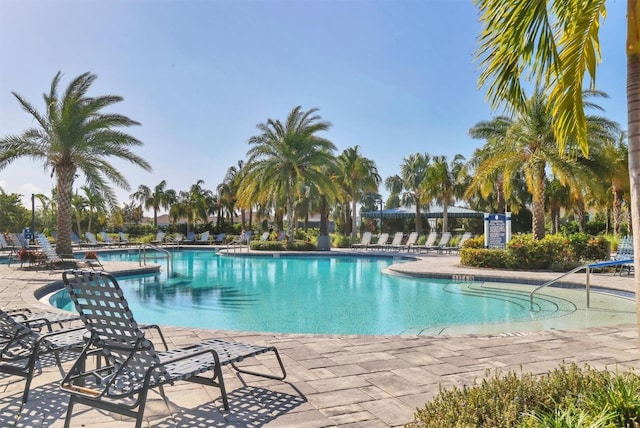 view of swimming pool featuring a patio area