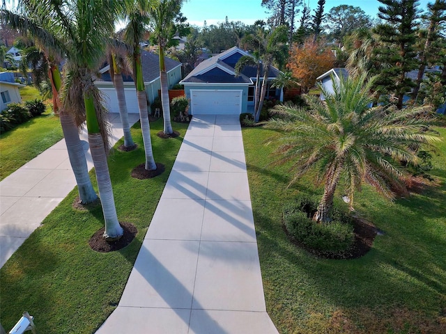 view of front facade featuring a garage and a front yard